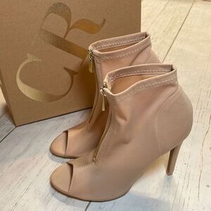 Charlotte Russe woman’s zip up fabric ankle boots. Size 8 color nude.